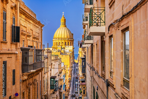 Valletta, Malta. Street that leeds down to the Grand Harbour and St Paul's Cathedral's dome.
