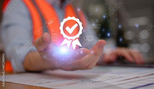 Engineer wearing safety vest holding glowing approval badge with checkmark icon above documents. Concept of quality assurance, certification, inspection, compliance, standards, and project approval.