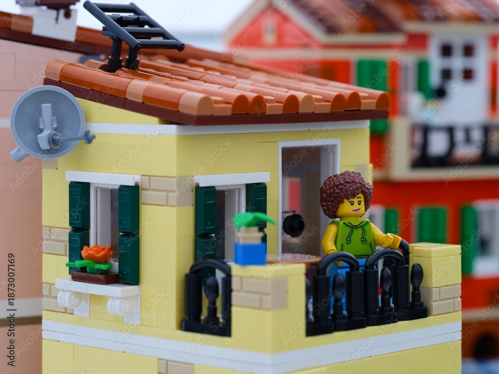 Fototapeta premium Tambov, Russian Federation - January 05, 2026 A Lego woman minifigure standing on her balcony. LEGO Ideas Italian Riviera set.
