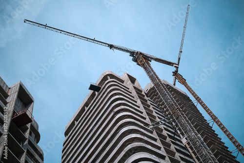 Tall modern building being built from concrete. High quality photo