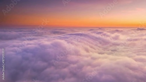 Seamless loop of flying above thick cloudscape. Cinematic purple and orange sky during golden hour. Dreamy nature background for travel and heaven concepts.
