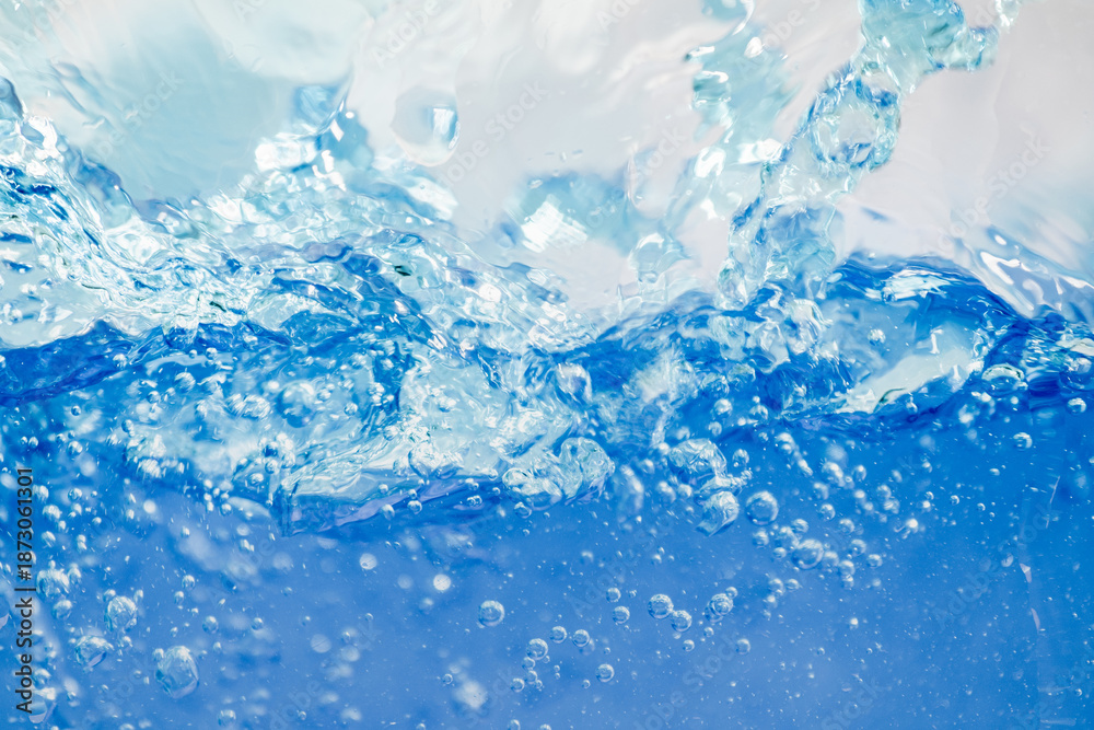 Obraz premium Closeup Transparent blue clear water surface texture with ripples. Abstract​ of​ surface​ blue​ splashes and bubbles​ water waves reflected​ with​ sunlight​