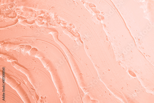 Cosmetic orange texture gel smudge background. Beauty product sample swatch.