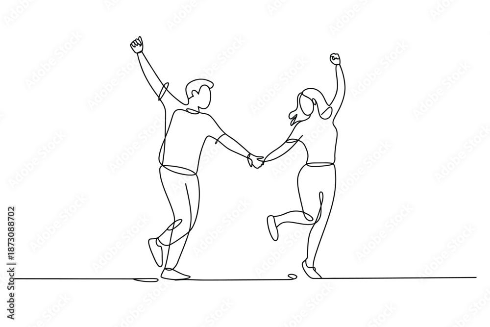 Fototapeta premium Joyful couple holds hands and dances in unison with raised arms.