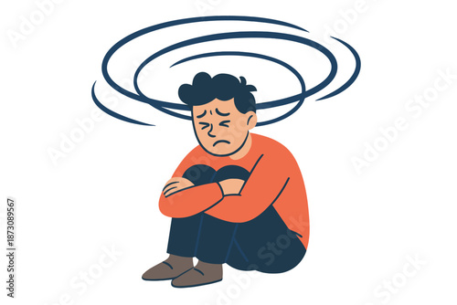 Person sitting on the floor with arms wrapped around knees while looking down, showing signs of distress and confusion