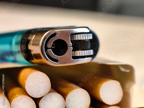 Close-up view of cigarettes and a disposable lighter. 