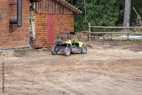 Utility Task Vehicle Parked Near Wooden Building