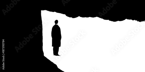 Silhouette of male figure standing in black and white minimalist scene