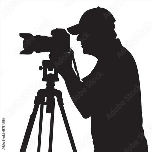 A solitary photographer stands silhouetted against an undefined artistic background