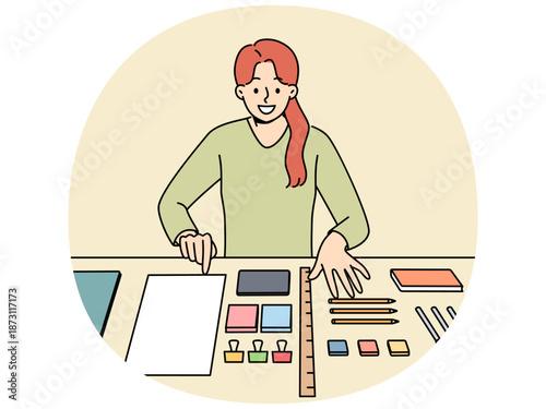 Perfectionist woman with OCD syndrome puts things in order on desktop and gets pleasure from perfectly placed stationery items. Girl with OCD disease smiles when she sees order in workplace