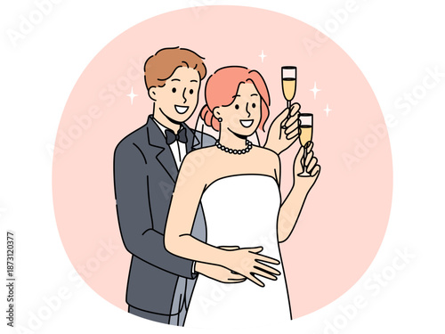 Newlyweds man and woman stand in embrace and hold glasses of champagne during wedding ceremony. Two newlyweds listen to congratulations from guests of festive event in honor of engagement