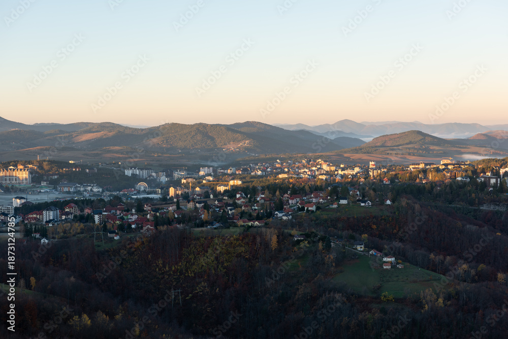 Fototapeta premium Gradina viewpoint at mountain Zlatibor offering beautiful view of city of Zlatibor in valley at morning, visit Serbia