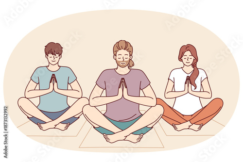 People do meditation and yoga sitting on fitness mats and taking lotus position to do zen practice. Friends meditate and do yoga to cleanse soul and improve mental state after difficult life period.