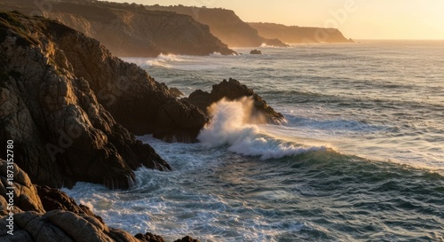 Rugged coast at sunset, waves crashing on rocks