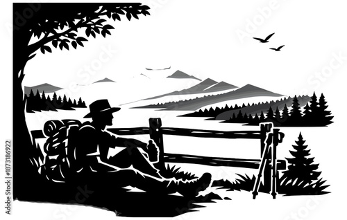 Silhouette of a hiker resting by mountain vista with backpack and camera