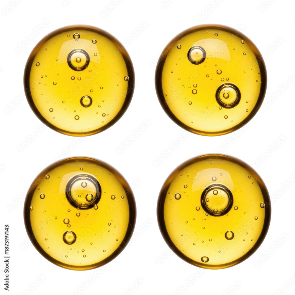 Fototapeta premium Four perfectly round, glossy, transparent, viscous golden yellow liquid drops with air bubbles, isolated on a transparent background with copy space, concept for high-end cosmetic or food