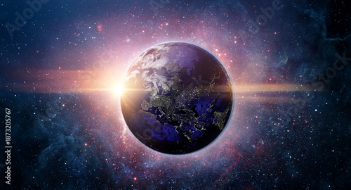 Planet Earth illuminated by sunrise against a deep space background with stars and nebulae, symbolizing global connection, science, astronomy.  Elements of this image furnished by NASA.