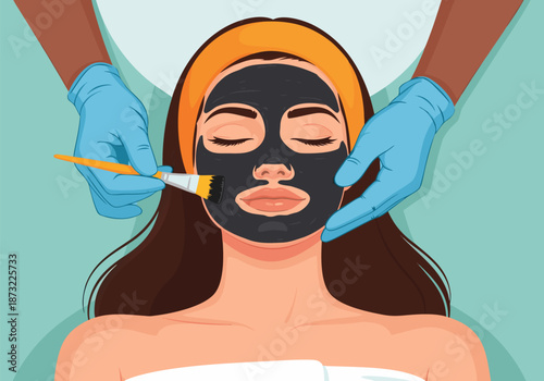 Woman receiving a charcoal facial mask application with a brush, promoting skincare and beauty treatments