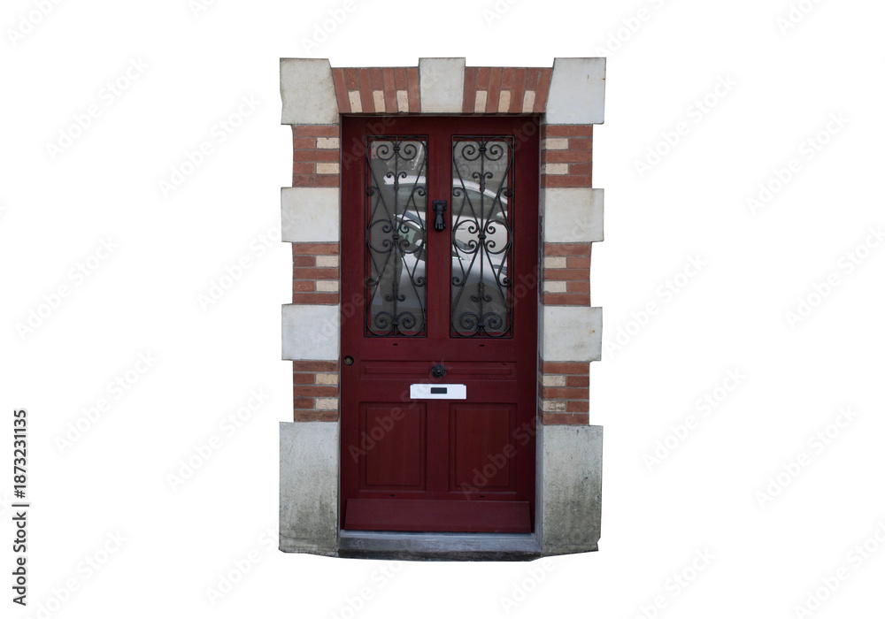 Fototapeta premium Puerta de entrada residencial de madera roja con marco de ladrillo y piedra