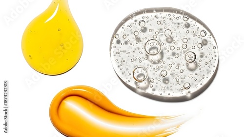 A close-up view of a vibrant yellow liquid droplet and smear alongside a clear gel or serum with bubbles on a white background showcasing textures.