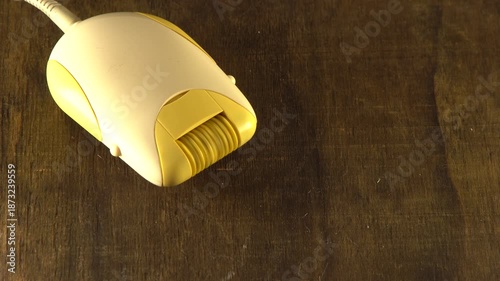 Epilator is working. Depilation hair removal tool. The tweezers are spinning. Video and sound work depilator