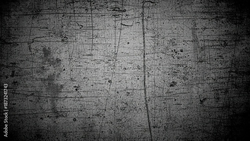Textured gray background with scratches and vignette effect for design