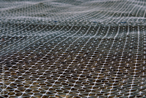 Bilde på lerret Groundwork preparation with geogrid wire mesh laid out on sub-soil surface for g