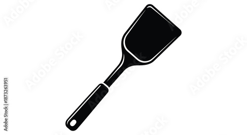 A simple black spatula presented against a white background a striking kitchen tool silhouette