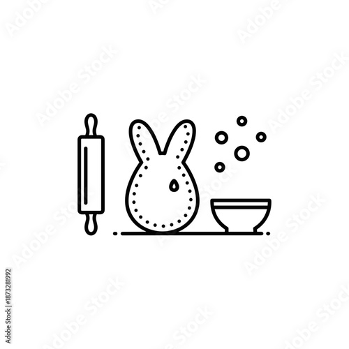 Easter bunny cookie cutter with rolling pin and bowl of sprinkles  