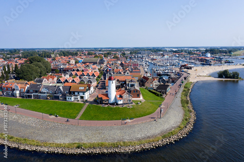 Drone photo of Urk village with the beautiful colorful lighthouse at the harbour by the lake ijsselmeer Netherlands Flevoland Europe
