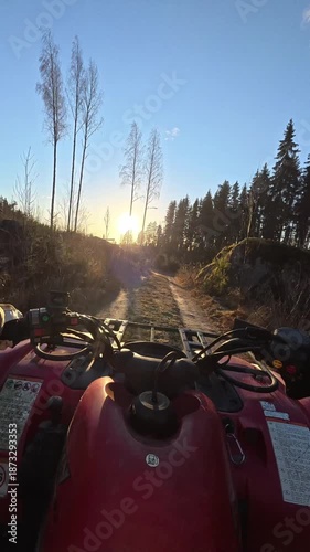 Vertical POV Driving Red ATV on Country Road at Sunset