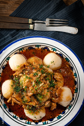 Dumplings with turkey and chorizo sauce.