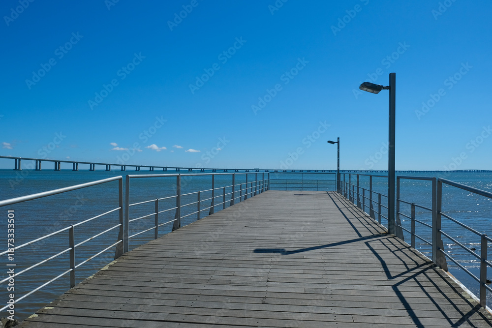 Fototapeta premium Vasco da Gama Bridge and Riverside Walkway at Parque das Nações in Lisbon