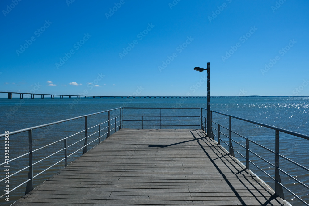 Fototapeta premium Vasco da Gama Bridge and Riverside Walkway at Parque das Nações in Lisbon
