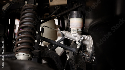 Old car suspensions. Close up car suspension wear and tear parts. CV joint Rubber boot and Control arms bushing Steering rack axles Shock absorber Brake exhaust. Gas Diesel car service repair parts.