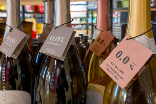 Paris, France - 01 10 2026: Dry January. Detail view of bottles of wine with a 0.0% alcohol-free label in a store