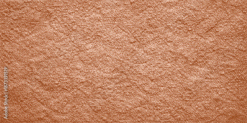 A vintage brown leather texture background with an aged grunge pattern on a rough antique surface material for blank design