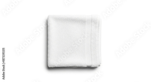 Soft white towel neatly folded on plain background