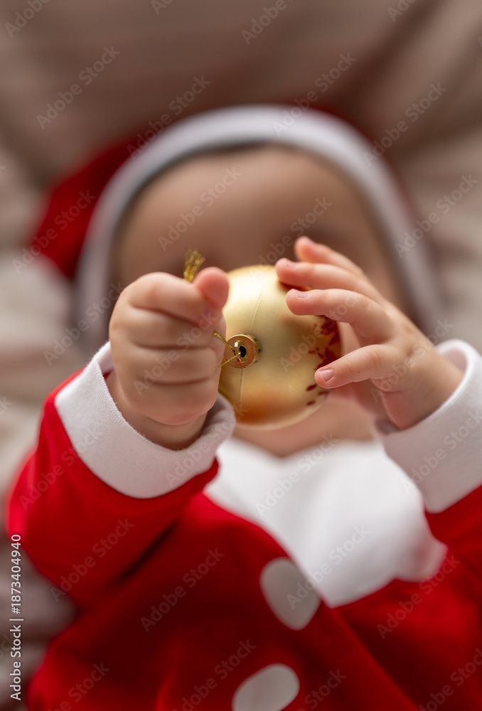Naklejka premium baby holding a toy