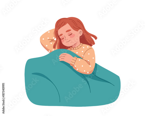 A young girl peacefully sleeping on a bean bag chair in a cozy setting.