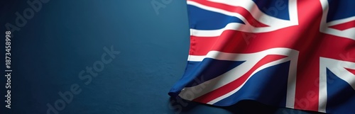 Free Download Union Jack flag texture fabric waves gently. Majestic United Kingdom emblem displays on navy background. Patriotic symbol celebrates national pride and history. - GFXLoad