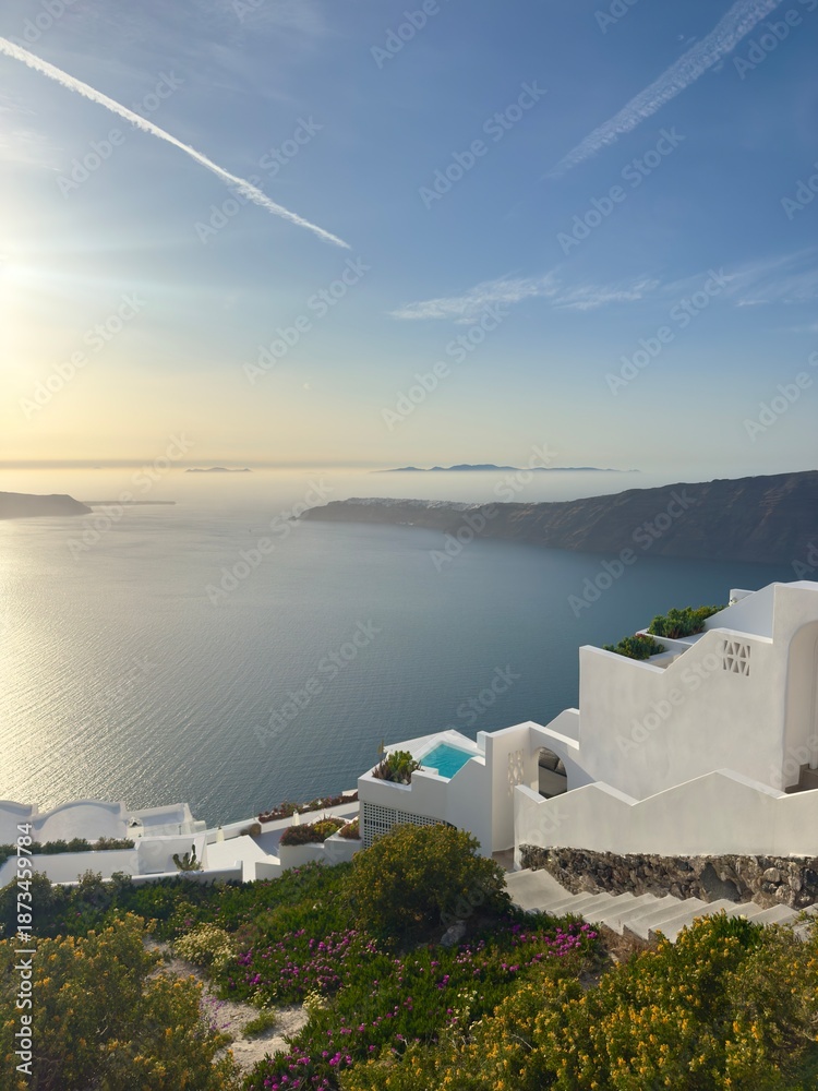 Fototapeta premium Santorini sunset over caldera with whitewashed villas and sea