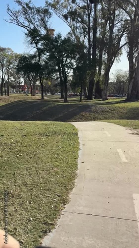 Vertical first-person video of riding a hands-free electric bicycle through the rural streets of Cordoba, Argentina