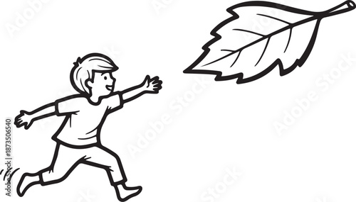 Boy running and chasing a leaf outdoors happily free