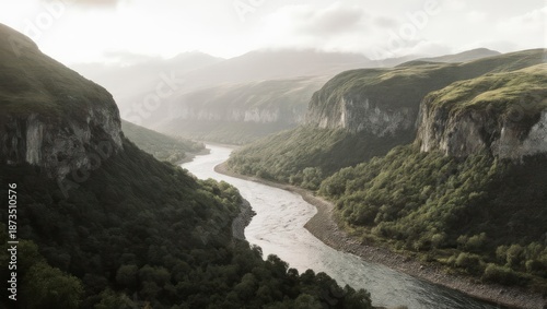 Wallpaper Mural Majestic River Carving Through Lush Green Mountain Valley at Sunrise. Torontodigital.ca