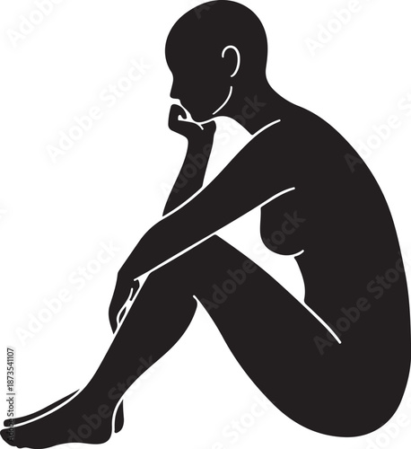 Silhouette of a contemplative person sitting in deep thought