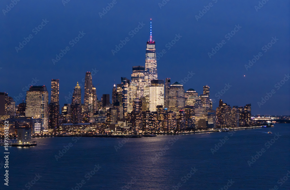Obraz premium New York City skyline. NYC skyline with Hudson landscape. New York cityscape. New York City at night. NYC cityscape. NYC night metropolis skyline. New York City skyline with skyscrapers at night.