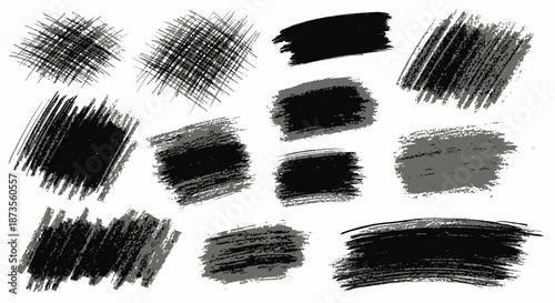 Collection of black brush strokes and smudges on white background.