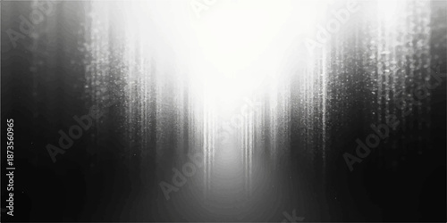 Polished silver stainless steel texture featuring brushed aluminum patterns and shiny chrome reflections under bright light rays from a spotlight on a metallic wall backdrop