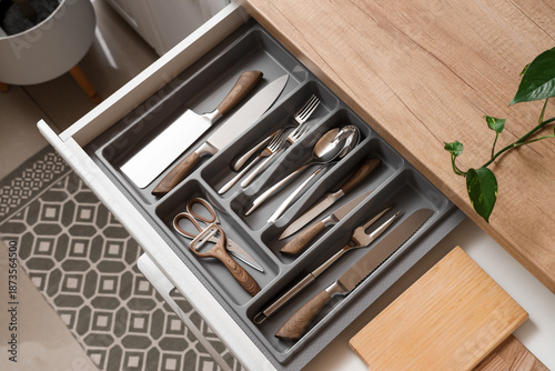 Open drawer with cutlery in...